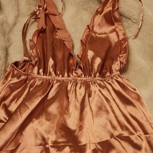Small shiny peachy/pink halter dress with adjustable straps